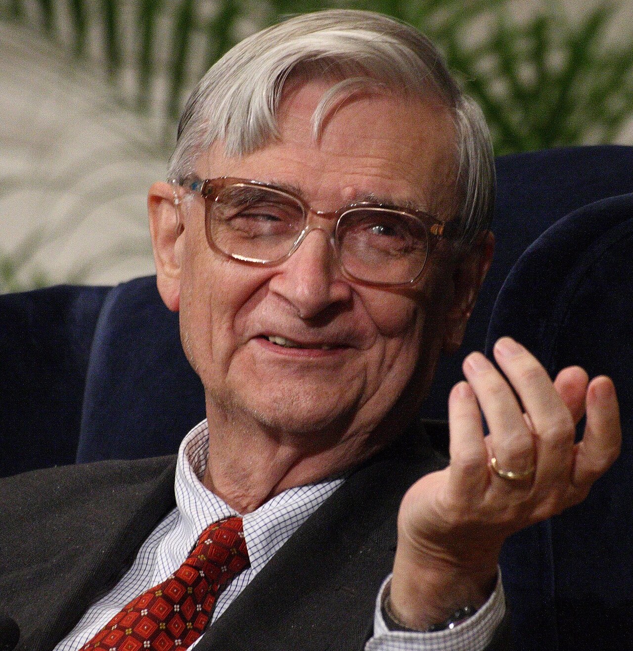 Edward O. Wilson, photographed in 2007, seated and speaking with one hand raised